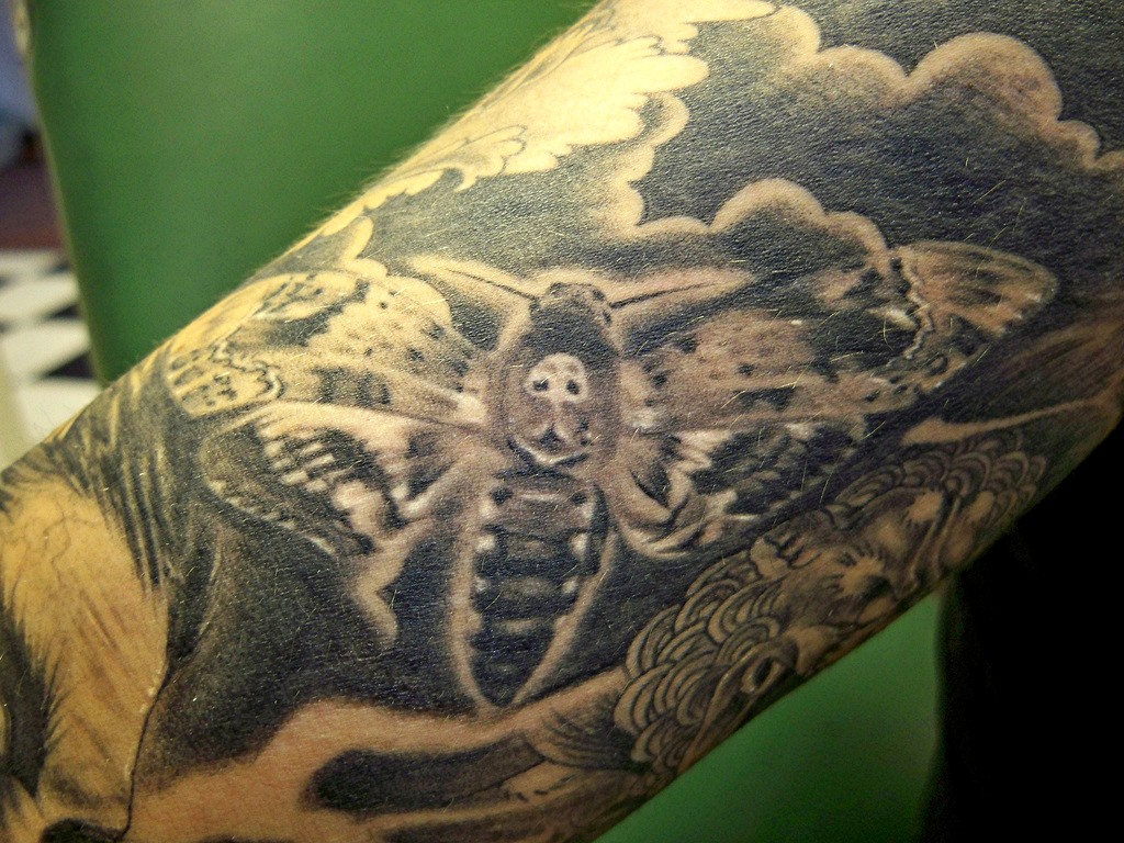 What is the meaning of a moth tattoo?